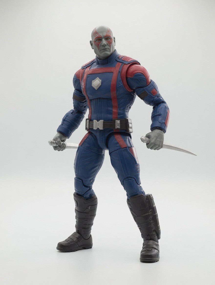 ImagineHaul Marvel Legends Drax action figure from Guardians of the Galaxy Vol. 3, wearing a blue and red suit and holding two daggers.
