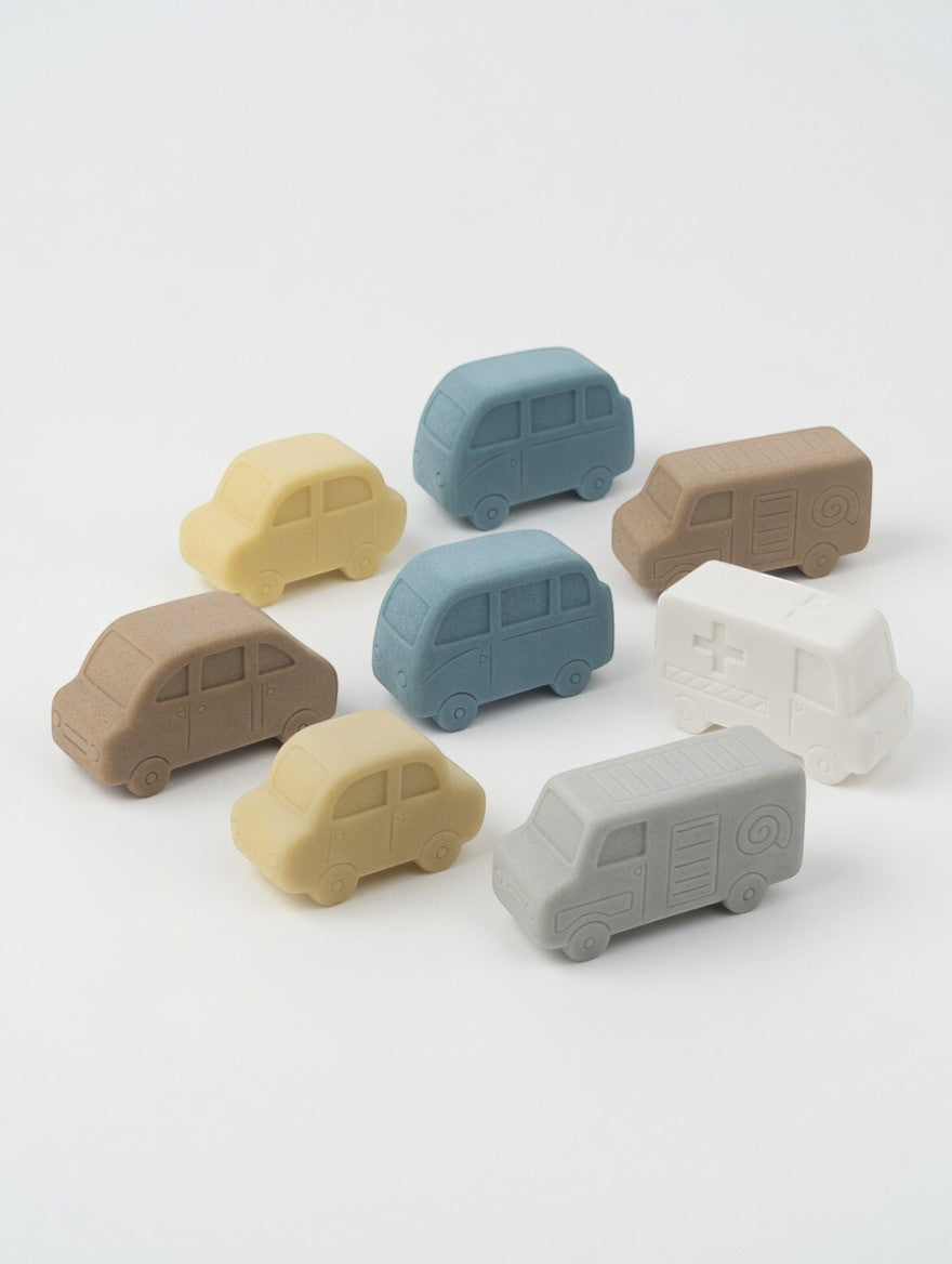 ImagineHaul Yellow Door Little Lands Vehicles sensory play stones in muted blue, tan, cream, and white. Set includes 8 vehicle sculptures.