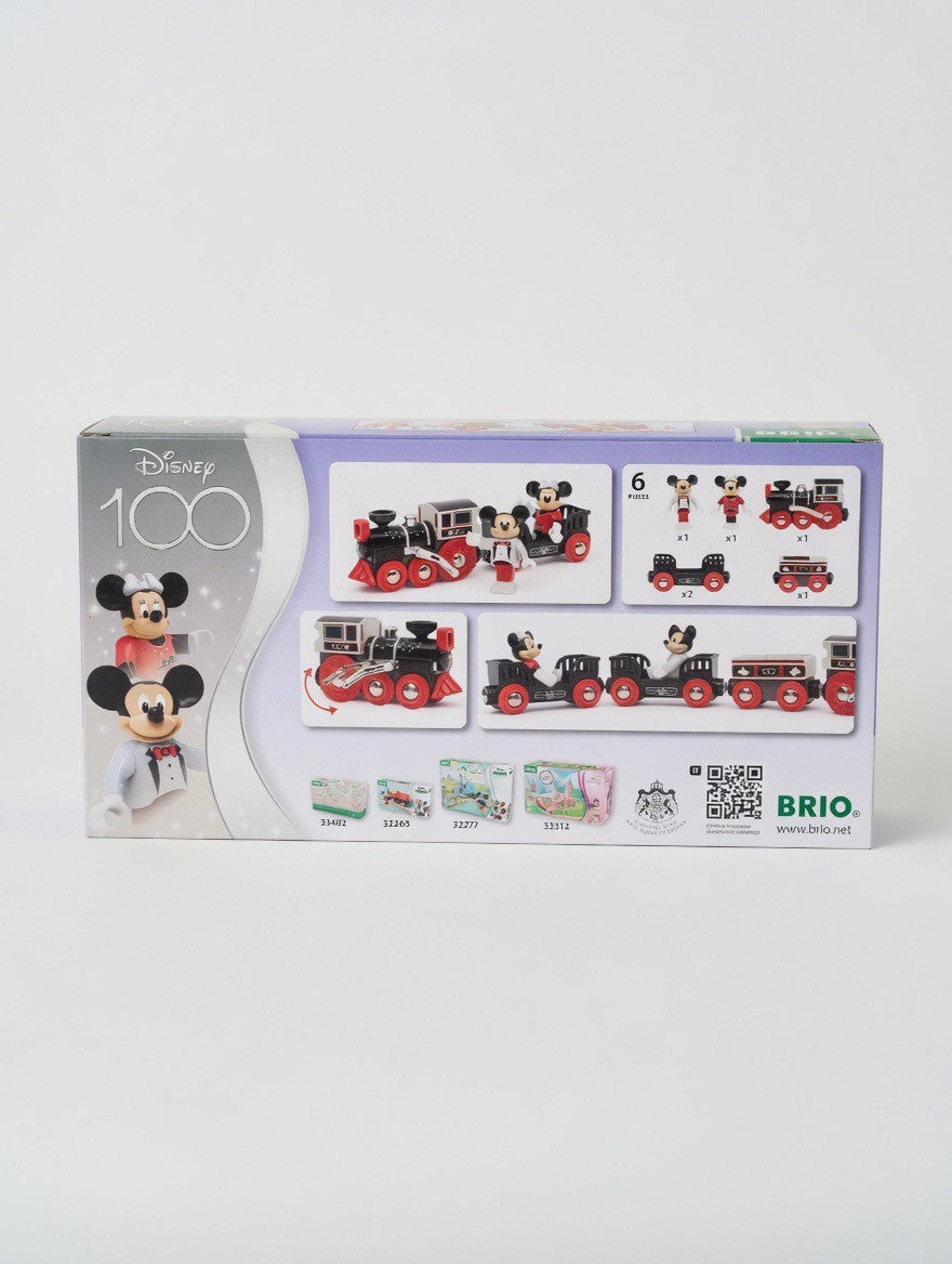 BRIO Disney 100th Anniversary Train set featuring Mickey and Minnie Mouse figures, black and red wooden train with gold accents, and cargo wagons.