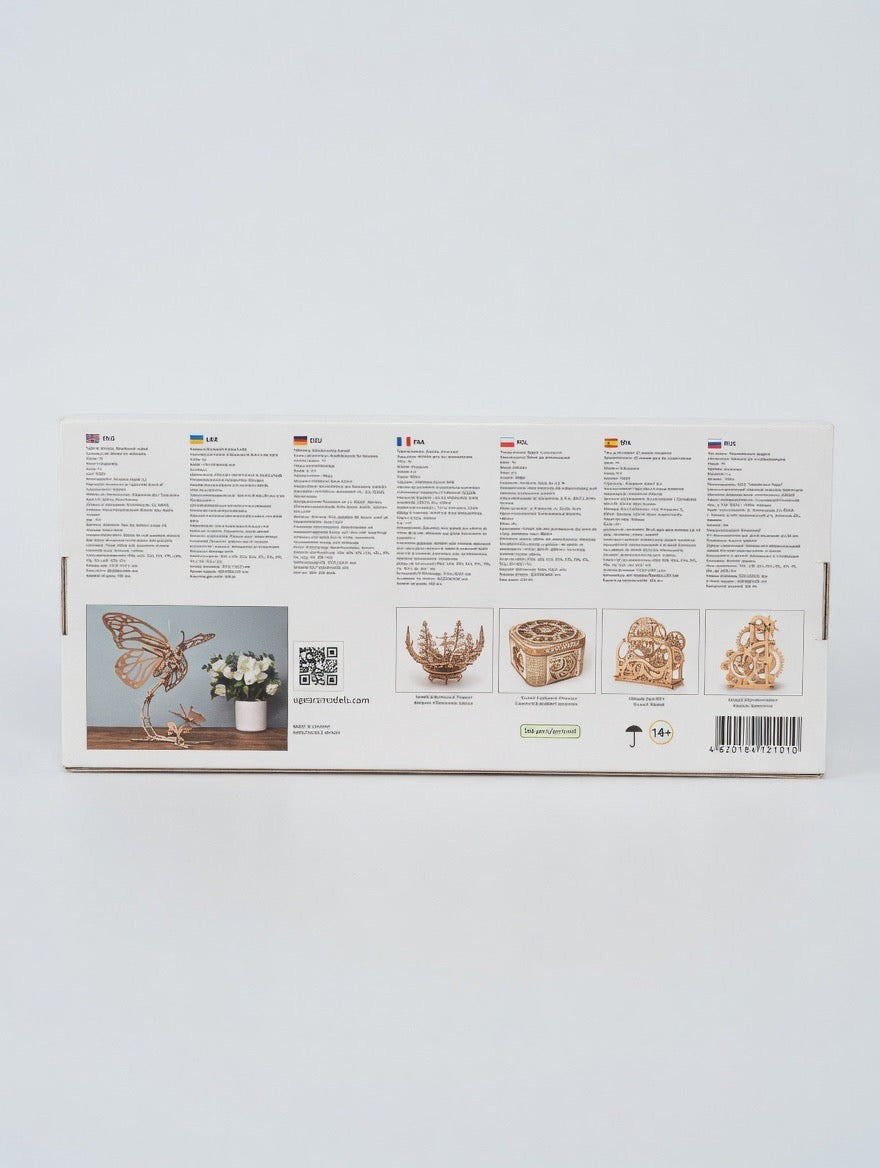 ImagineHaul UGEARS Butterfly mechanical wooden model kit with 168 birch plywood pieces, featuring moving wings on a flower stem.