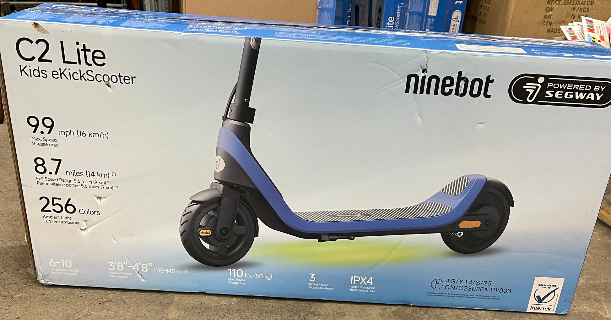 Ninebot by Segway C2 Lite kids electric scooter in blue and black, featuring 256 customizable LED colors and a 9.9 mph top speed.