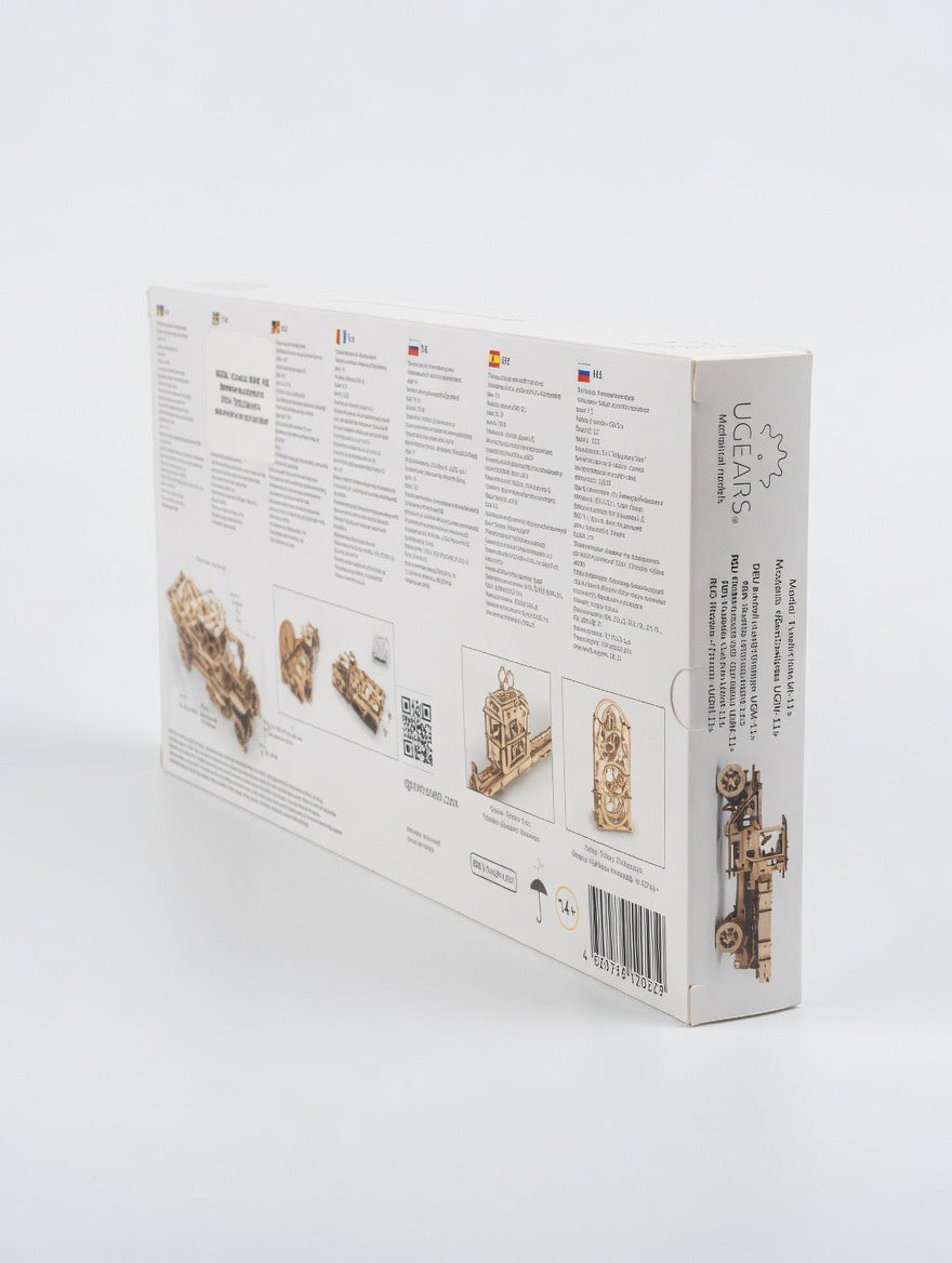 ImagineHaul UGEARS Truck UGM-11 mechanical wooden model kit box with detailed diagrams and multilingual text.