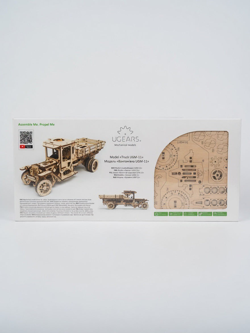 ImagineHaul UGEARS Truck UGM-11 mechanical wooden model kit. Features laser-cut birch plywood pieces and a rubber-band powered drivetrain.